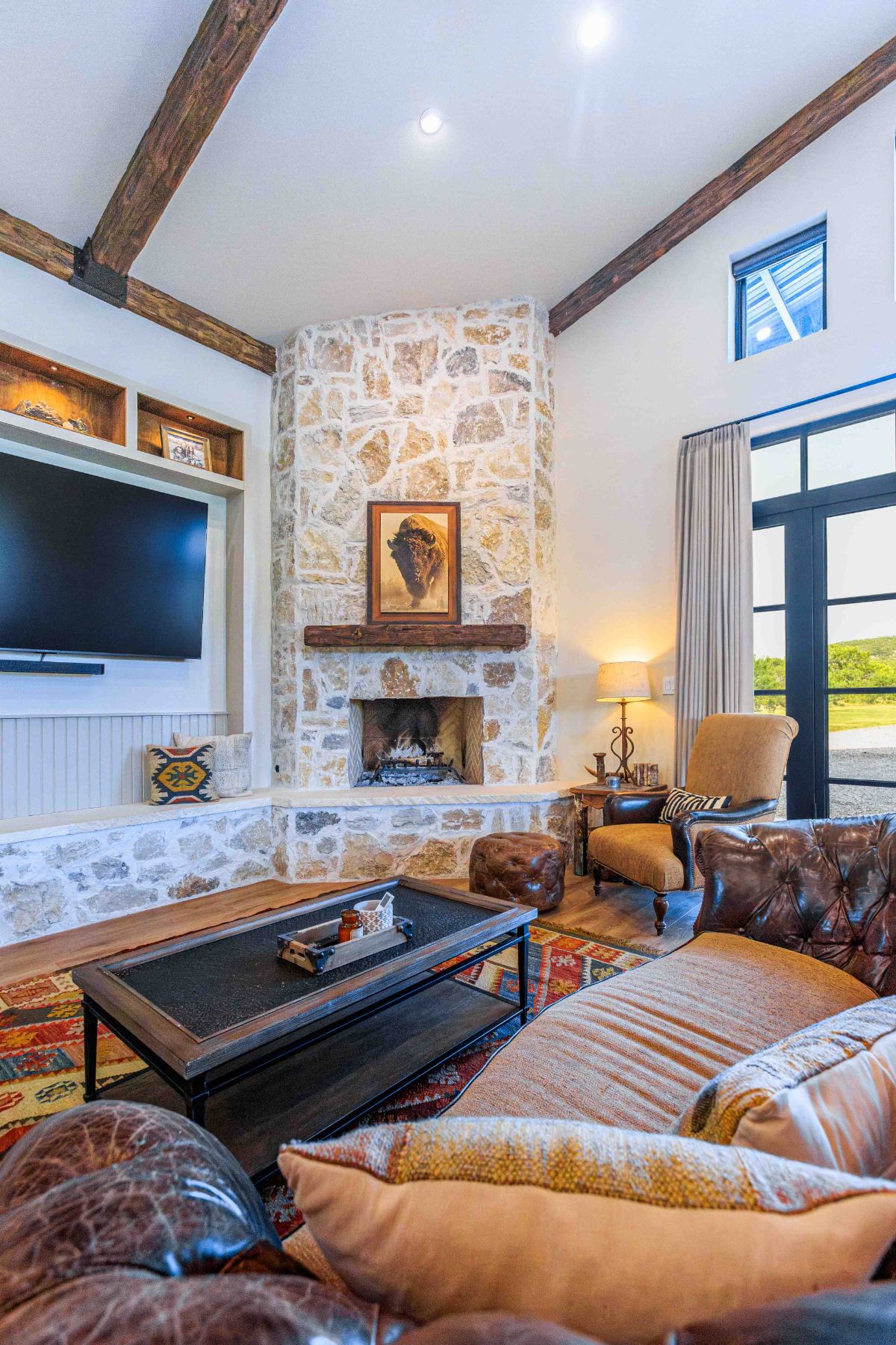 Living room with stone fireplace